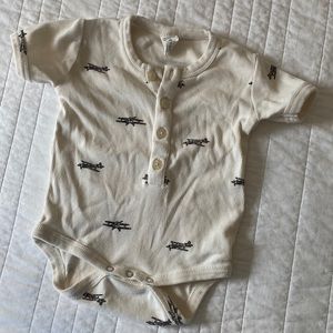 Kate Quinn airplane onesie